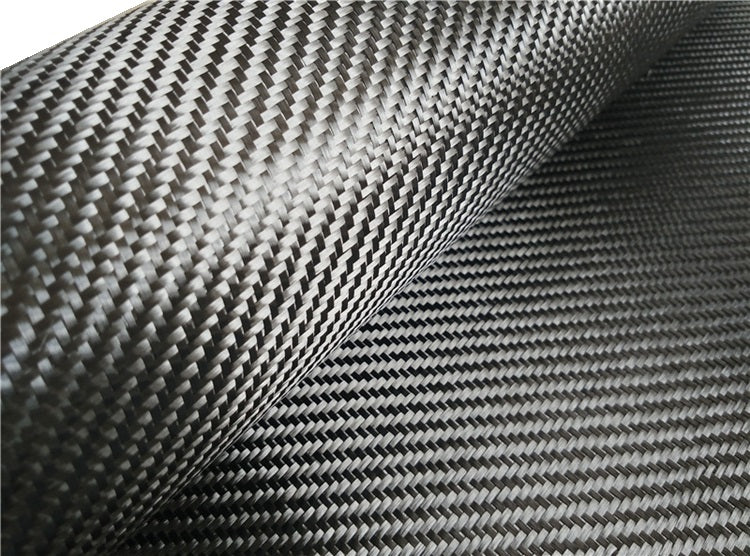 High-quality carbon fiber twill fabric from Camacho Composites with a glossy, detailed weave pattern.
